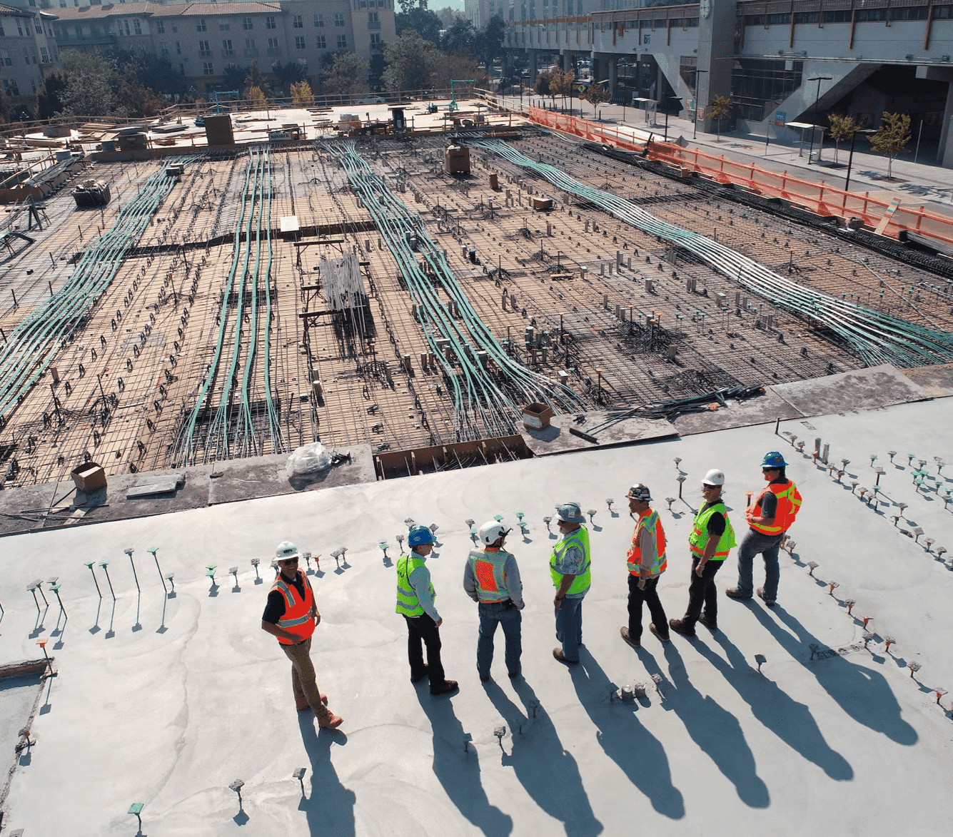 Construction site, construction team, Client, subcontractor, contractor, steel, reinforcement, civil engineering, building under construction, concrete, pipes, site meeting, works, team work, meeting, discussion, supervising, handovers, milestone